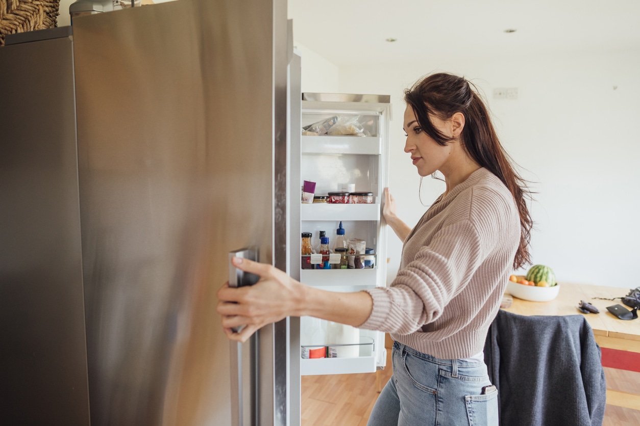 VegNews.WomanFridge.Getty